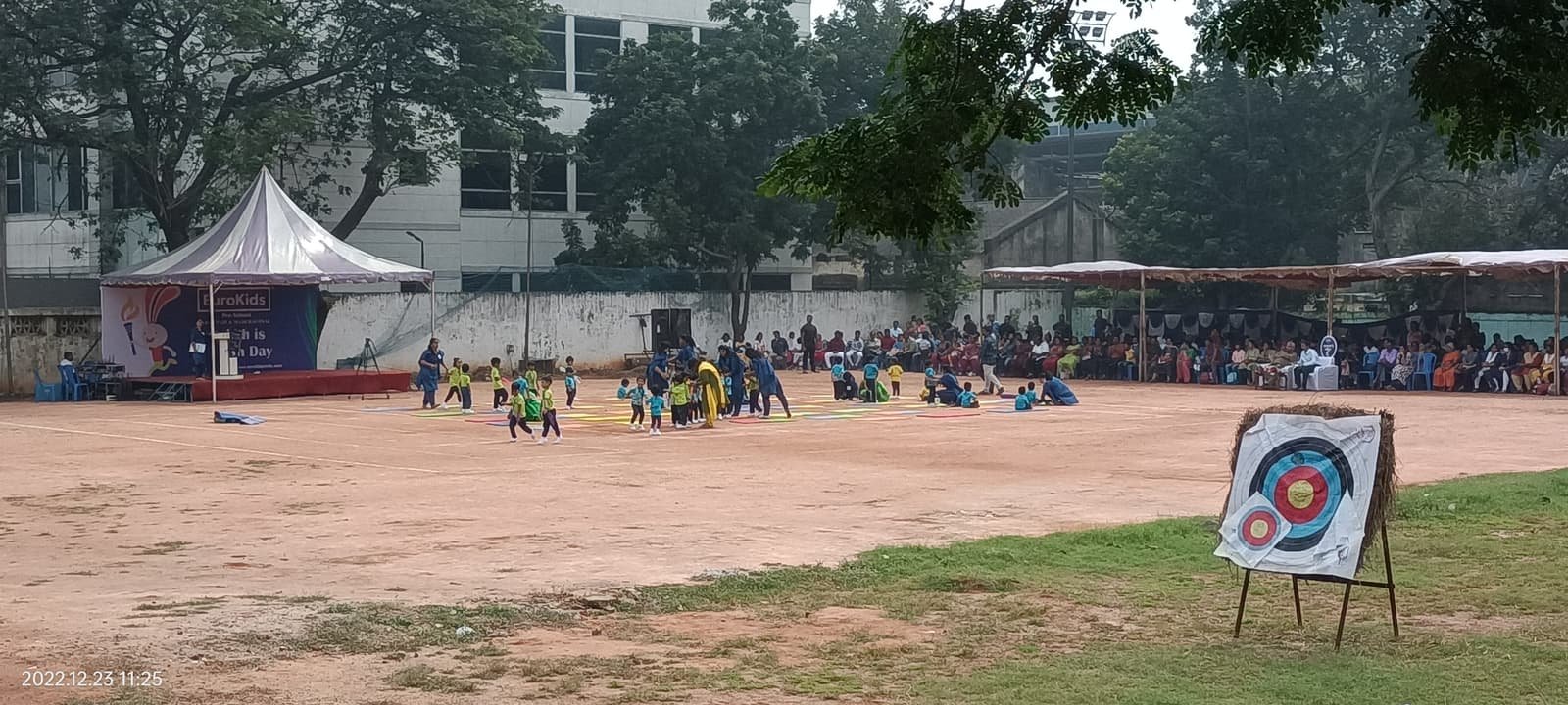 Preschool sports day at 5rings with event tent, archery target and seated parents